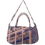 Low Angle Photography Of Beige And Blue Building Removal Strap Handbag