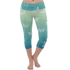 White Butterflies On Blue And Light Green Capri Yoga Leggings by SpinnyChairDesigns