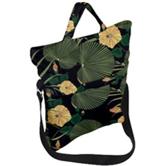 Tropical Vintage Yellow Hibiscus Floral Green Leaves Seamless Pattern Black Background  Fold Over Handle Tote Bag by Sobalvarro
